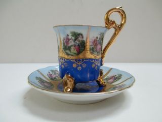 Antique/vintage Royal Hand Painted 3 Footed Porcelain Tea Cup & Saucer Set.