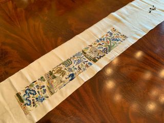 A Chinese Qing Dynasty Embroidered Silk Sleeve Band.