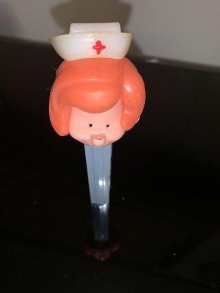 PEZ Nurse,  red head,  no feet,  rate,  austria,  patent 3,  410,  455,  Antique 2