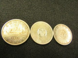 3 Canada Silver Dollars 2 1964= 1 - 1963= You Grade It Please 100