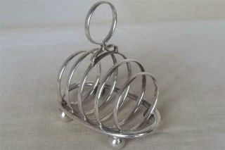A Stunning Antique Solid Sterling Silver Round Toast Rack By Walker & Hall 1912.