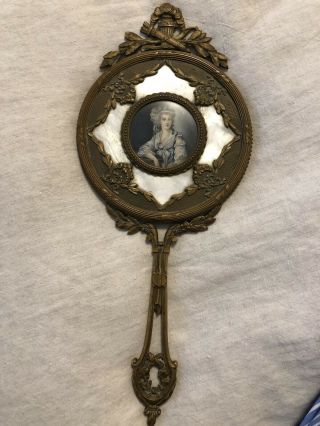 Antique Brass Beveled Hand Mirror With Victorian Portrait Set In Mother Of Pearl
