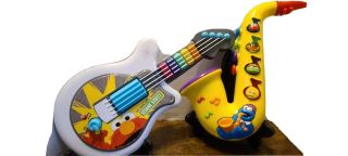 Sesame Street 1999 Cookie Monster Saxophone & 2010 Elmo Guitar Cond