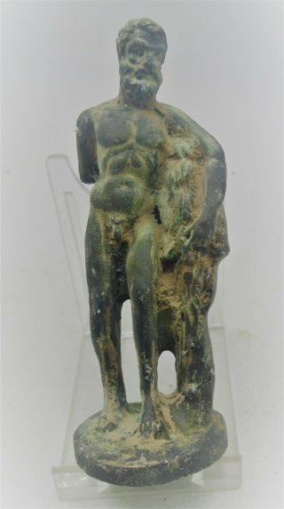 Ancient Roman Bronze Statuette Of A God,  Lion On The Side,  200 - 300ad