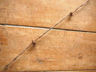 Ponds Drilled & Bent Four Point Sheet Metal Plate Barb - Antique Barbed Wire