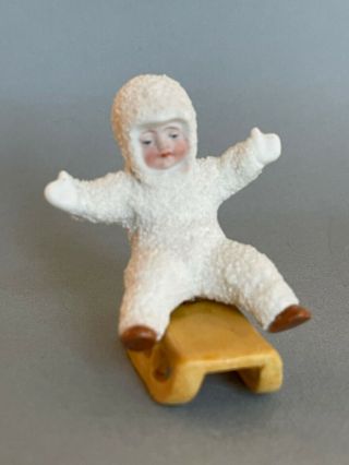 Antique Bisque German Snow Baby Seated On Separate Bisque Sled
