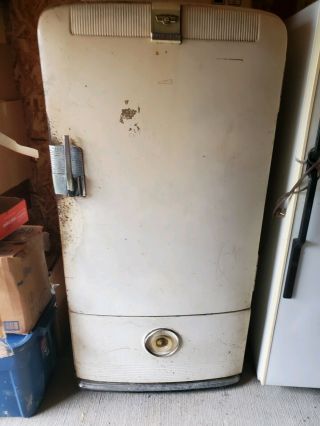 Frigidaire Refrigerator Beige In Color And Is A Antique