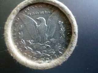 roll of 20 silver dollars with an O showing and an S showing on the ends 2