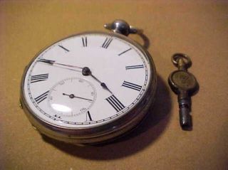 An Open Face Antique Key Wind Pocket Watch.  935 Fine Silver = = With Key