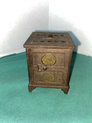 Vintage / Antique Small Cast Iron Bank With Coins Inside