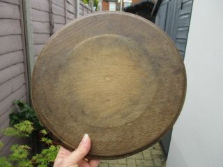 An Antique Carved Wooden Bread Board - 