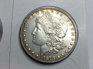 1878 7 Tail Feather Morgan Dollar In Almost Uncirculated