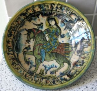 A Persian Glazed Ceramic Bowl,  Decorated with a Lady on Horseback,  27cm diameter 3