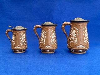 3 X Antique 19th Century Neo Gothic Style Graduated Pottery Jugs With Pewter Lid