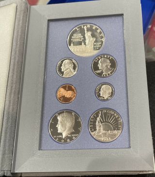 1986 Prestige Set With 90 Silver Dollar And 7 Proof Coins