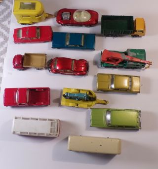 A Grouping Of 14 Vintage Lesney Matchbox Cars And Trucks
