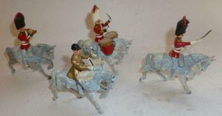 Four Solid Lead Or White Metal Mounted British Guards Bandsmen