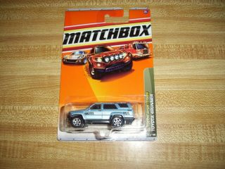 Matchbox 2010 74/100 Outdoor Sportsman Toyota 4runner 1985 Light Blue Carded
