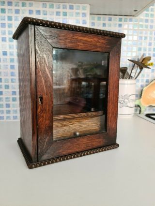 Vintage Oak Smokers Cabinet With Glass Paneled Door And Inner Draw