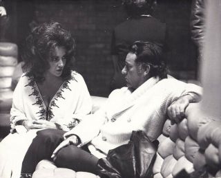 Elizabeth Taylor And Richard Burton Sit On Sofa Candid Vintage Photo