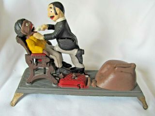Vintage Cast Iron Mechanical Dentist Pulling Black Man 